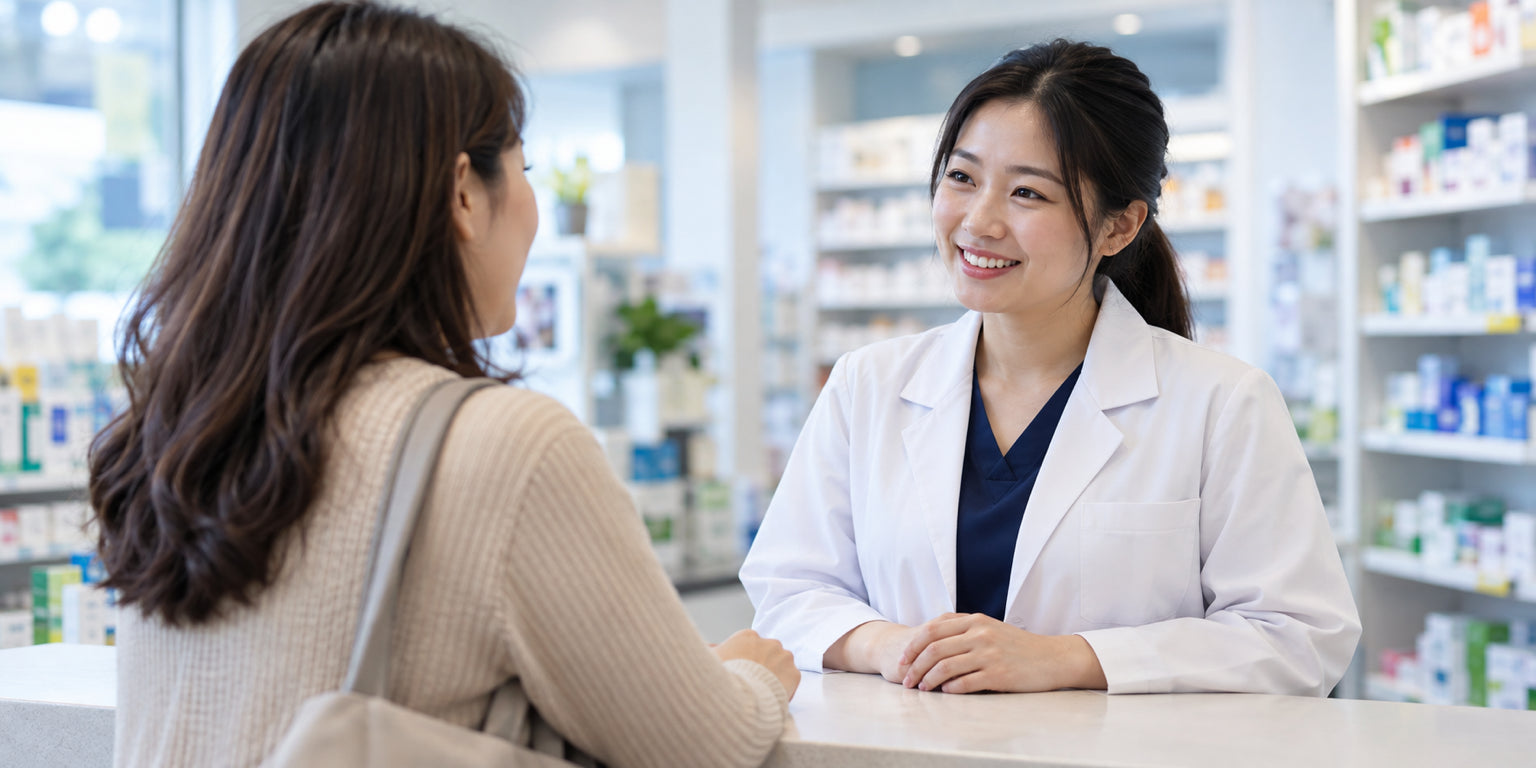 A pharmacist speaking with a customer in a bright pharmacy